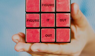 Interview questions represented by Red Rubik's cube with words around solving a puzzle